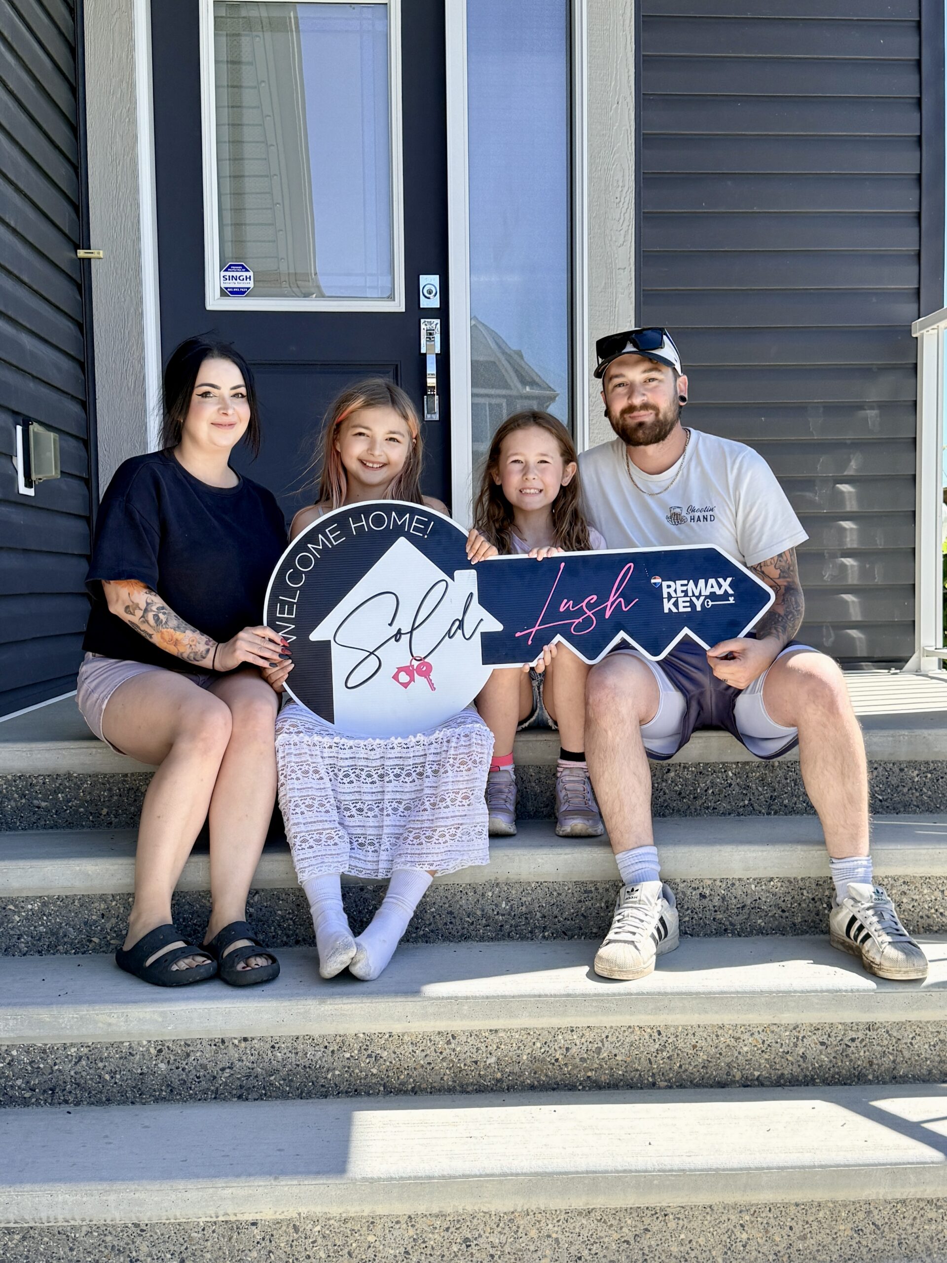 Lush Realty clients celebrating a home purchase